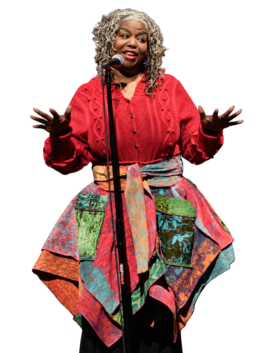 Dr. Sabrina Jackson speaking into a microphone with her hands raised
